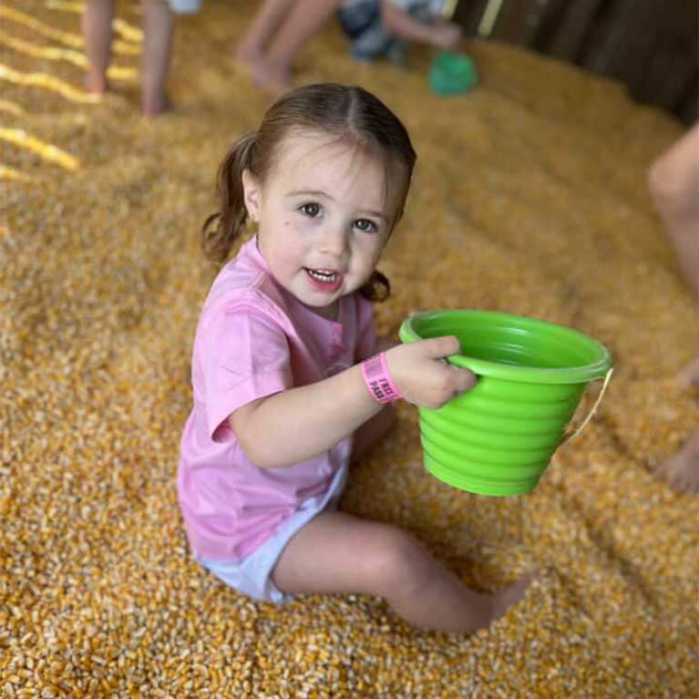 Hop into our giant corn bin at Seward Farms in Lucedale, MS.